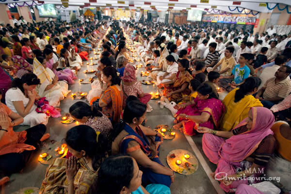 Devotees participating in puja