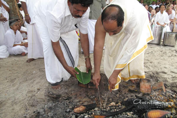Amma's elder brother Collecting some of the ashes for spreading it in spiritual location as per tradition