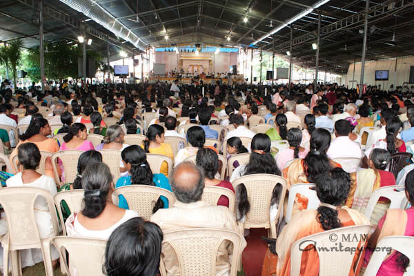 Devotees listening to Amma's words