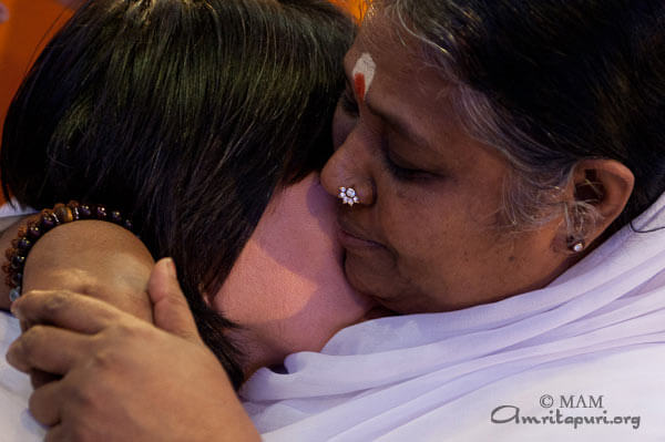 Amma's darshan: a whisper of love