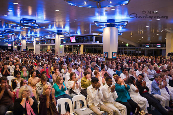 Devotees partaking in Atma Puja