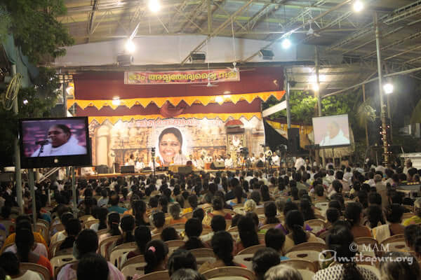 Devotees listening to Amma