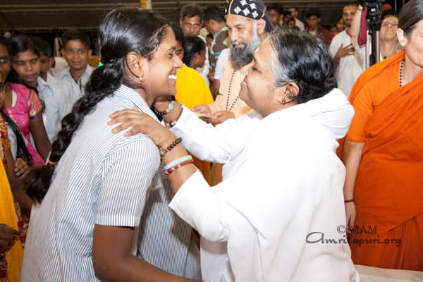 Amma talks to a student in Kottayam