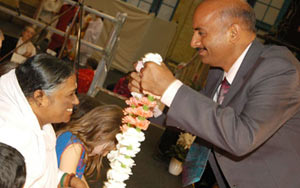 Sanjay Shrinet with Amma in London