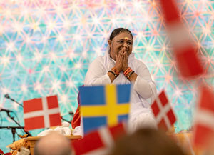 Amma a beacon in a world which faces huge challenges