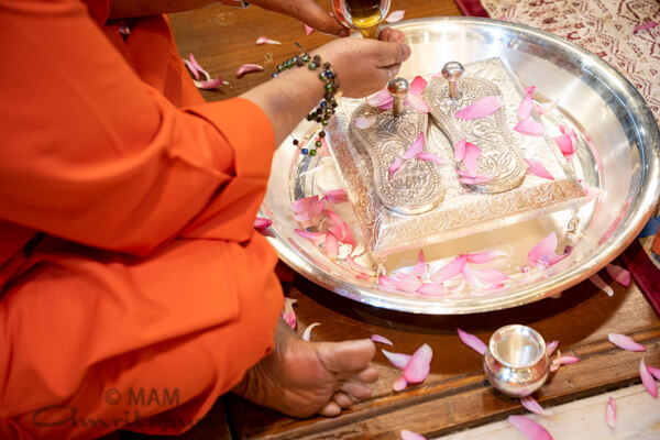 Swamiji performing Amma's Paduka Puja