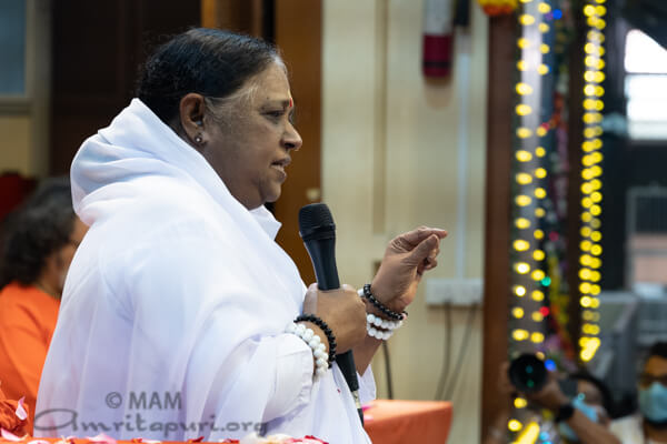Amma is speaking to the devotees