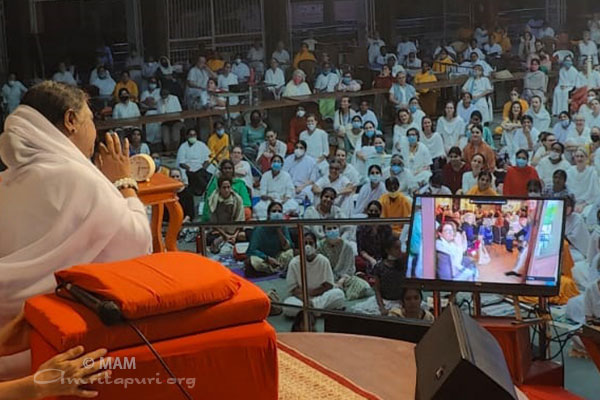 Amma interacting with the gathering live from Amritapuri