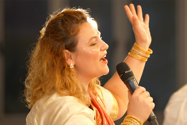Devotee singing a Christmas song