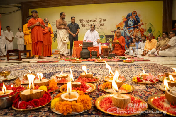 Amma performing a puja in Amritapuri