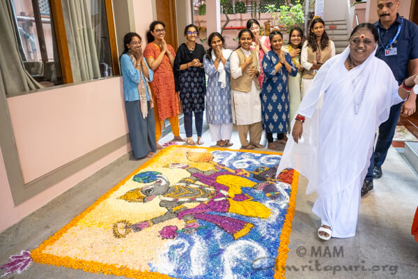 Onam arrives at Amritapuri with flowers, creativity, and devotion