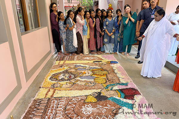 Onam arrives at Amritapuri with flowers, creativity, and devotion