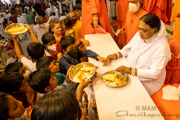 Amma serving prasad