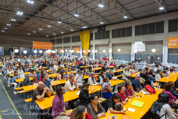 Sitting at the dinning hall, devotees listening to Amma  Sitting at the dinning hall, devotees listening to Amma