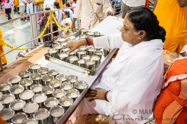 Amma serving prasad