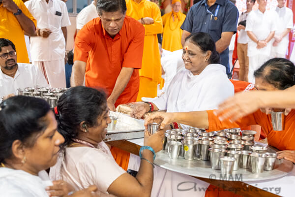 Amma serving prasad