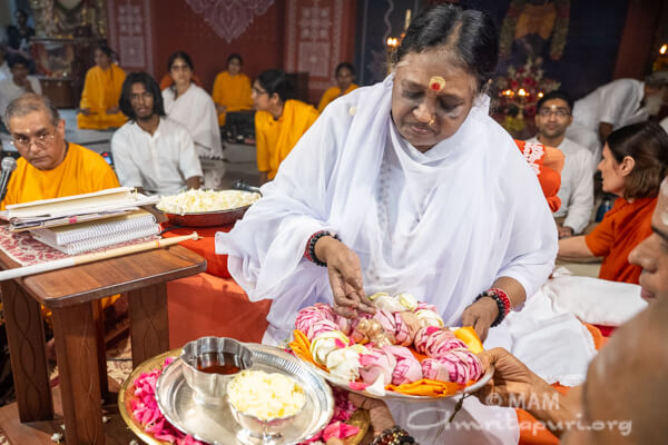 Giving honey to baby Krishna