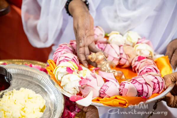 Giving honey to baby Krishna