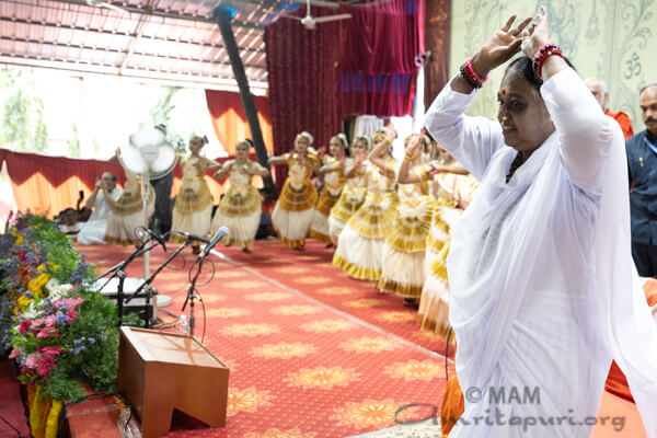 Amma doing pranams to all gathered