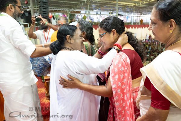 Amma distributing saris