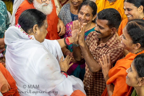 Amma is playing with children