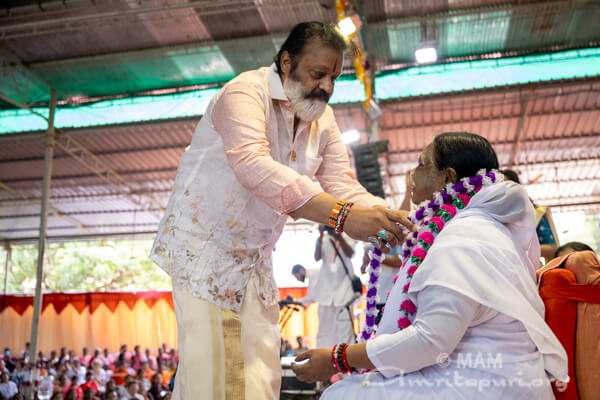 Union Minister Sri Suresh Gopi garlanding Amma