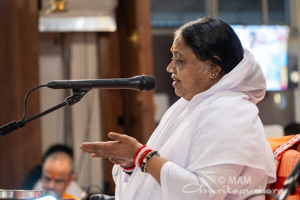 Amma initiating Vidyarambham
